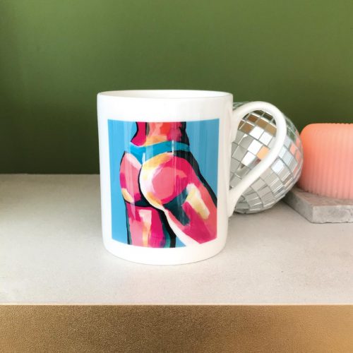 china mug with pink butt on a blue background