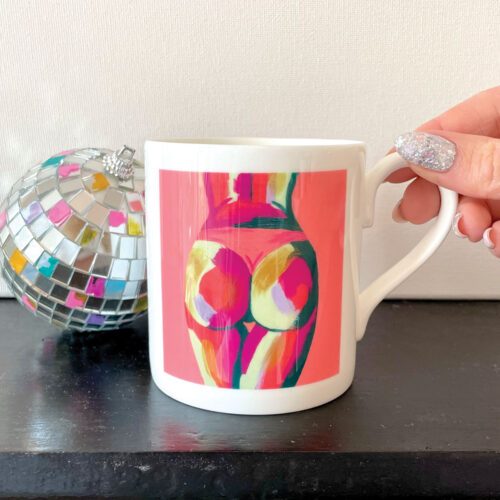 Peach bone china mug with bum painting and disco ball to side